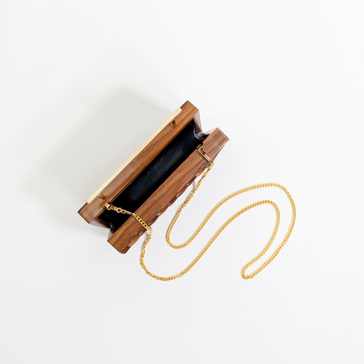 Clutch con borde reluciente
