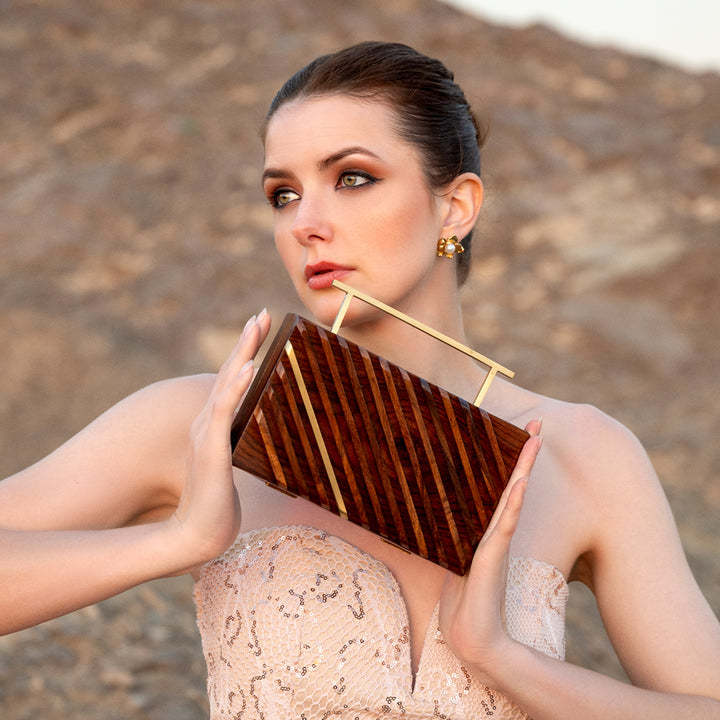Clutch con borde reluciente